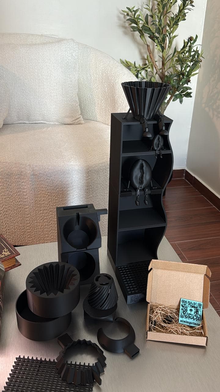 Collection of black 3D-printed coffee organizers, holders, shelves, and accessories